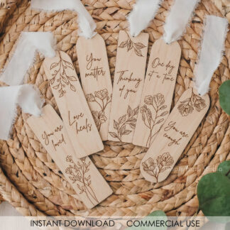Floral bookmark SVG bundle with six engraved wildflower designs and short phrases on light wood, ready for laser cutting on Glowforge or xTool